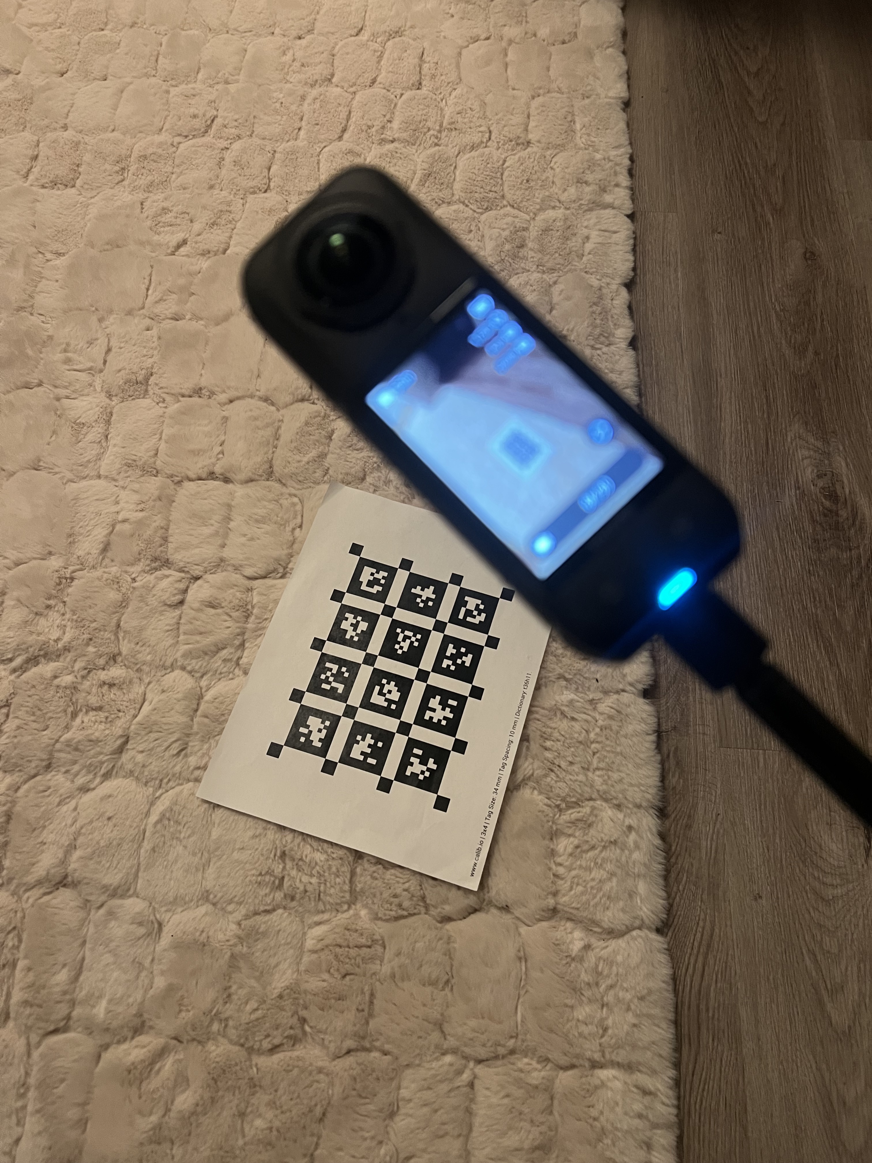The metric calibration board should be placed in view of the 360 camera in the beginning of the scan.